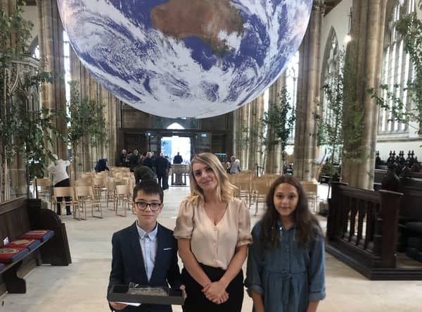 William Alvey School pupil sDavid and Ithar with Year 6 teacher Natalie Mason at Hull Minster for the centenary service. EMN-210823-175650001