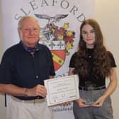 Footballer Lottie Wells receives the Young Sports Individual Award 2020 from past Mayor of Sleaford, Coun Anthony Brand. EMN-210727-172705001