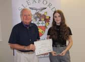 Footballer Lottie Wells receives the Young Sports Individual Award 2020 from past Mayor of Sleaford, Coun Anthony Brand. EMN-210727-172705001