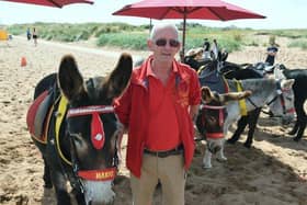 John Nuttall is the third generation of a family giving donkey rides to children on Skegness beach.