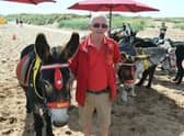 John Nuttall is the third generation of a family giving donkey rides to children on Skegness beach.