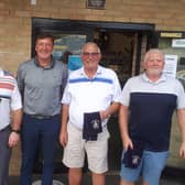 Grant Brown (second left) with the winning team, from left, Jeff Purdy, Roger Smith and Ian McParland. Not pictured: Eddie Malloy.