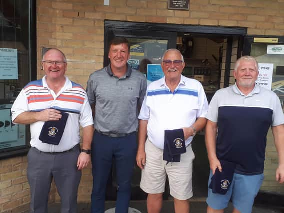 Grant Brown (second left) with the winning team, from left, Jeff Purdy, Roger Smith and Ian McParland. Not pictured: Eddie Malloy.