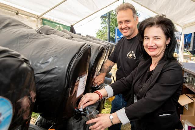 Landlord John Walker and landlady Livia Muresan serving up refreshment at their beer fest. EMN-210830-114539001