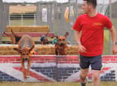 Runner Jordan Williams leads the hounds racing over the obstacles. Jordan Williams is set to raise money for Help for Heroes, taking part in a relay cycle ride on static and road rides from John O'Groats to Land's End on September 17-18. EMN-210830-130021001