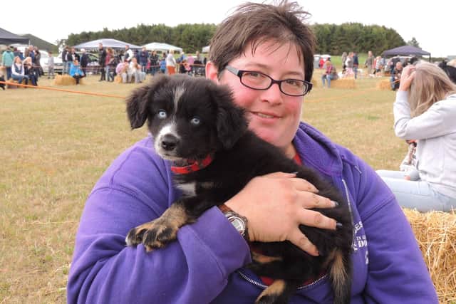 Naomi Evans of Cranwell was taking part in the fun dog show with Riot, a nine week-old miniature American Shepherd. EMN-210830-125830001