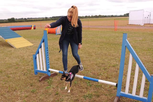 Sophie Kirk of Billinghay has a go at the dog agility course with Lilly the chihuahua. EMN-210830-125820001