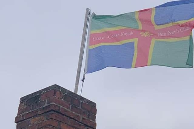 The Lincolnshire flag flies above the Shoulder of Mutton in Ruskington on Mark and Sunny's return. EMN-210830-192918001