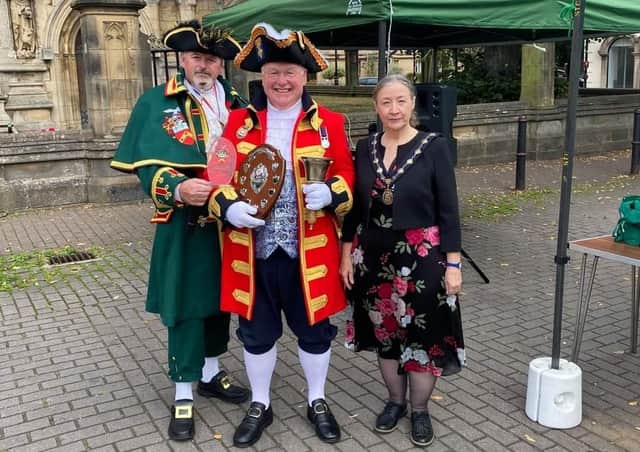 The winner of Sleaford Town Crier contest 2021 - Michael Wabe of Watton, with Sleaford crier John Griffiths and Coun Linda Edwards-Shea - Deputy Mayor. EMN-210609-183140001