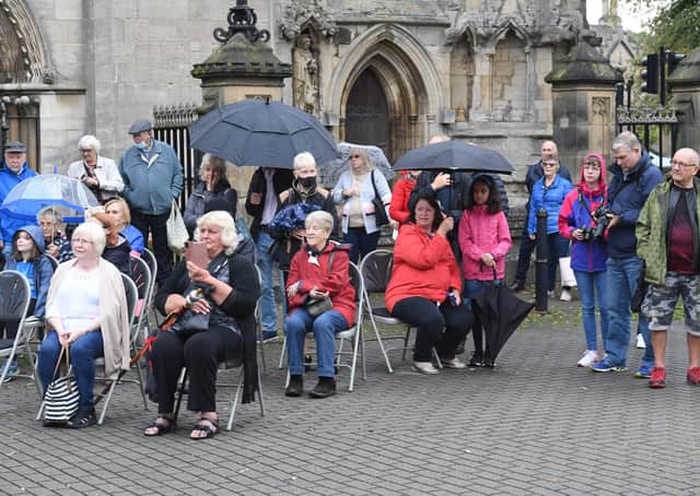 Spectators listening to the town crier contest in Sleaford Market Place. EMN-210609-121248001