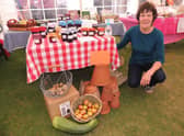 Sue Harris with the Caythorpe and Frieston Allotment Association stall - full of produce. EMN-210609-143856001