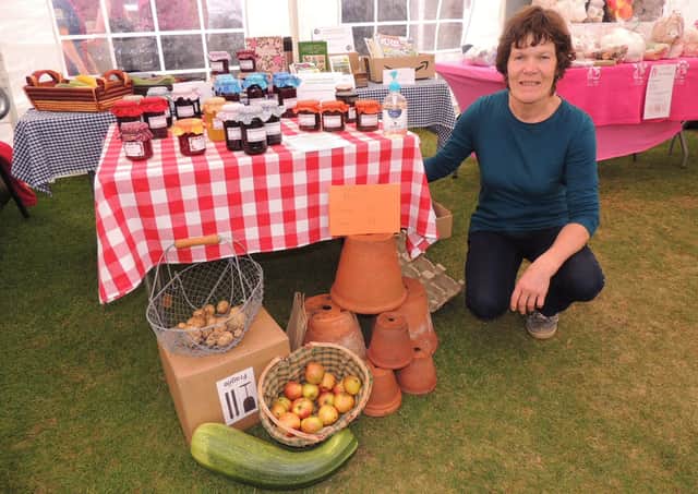 Sue Harris with the Caythorpe and Frieston Allotment Association stall - full of produce. EMN-210609-143856001