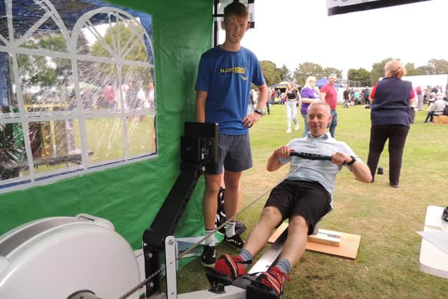 Mark and Stanley Pocock doing the 200m rowing challenge at Caythorpe Gala. EMN-210609-143906001