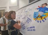 The writing on the tablecloths at Jolly's World Cafe in Skegness is transferred onto the board.
