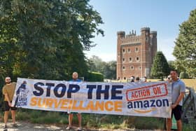 Action against Amazon protest at Tattershall Castle, form left: Sam Luczynski, Shawn Betts and Bogdan Idasiak. EMN-210809-140257001
