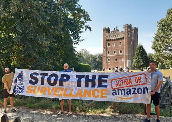 Action against Amazon protest at Tattershall Castle, form left: Sam Luczynski, Shawn Betts and Bogdan Idasiak. EMN-210809-140257001