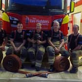 Some of the Billingborough fire crew getting ready for their charity hose run out on Saturday. EMN-210909-165024001