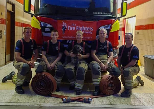 Some of the Billingborough fire crew getting ready for their charity hose run out on Saturday. EMN-210909-165024001