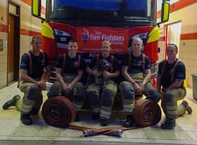 Some of the Billingborough fire crew getting ready for their charity hose run out on Saturday. EMN-210909-165024001