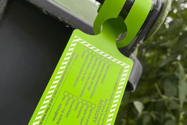 Bin crews will add advisory tags to wheelie bins containing the wrong recyclable waste. EMN-210913-164247001