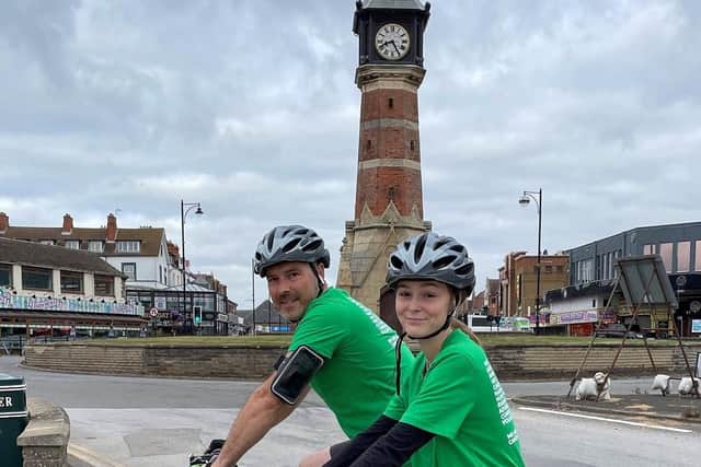 Sophie Bastow and dad at the Skegness clock tower. EMN-210913-113703001