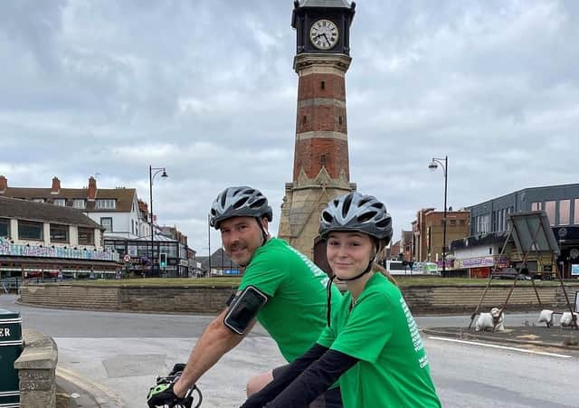 Sophie Bastow and dad at the Skegness clock tower. EMN-210913-113703001
