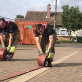 Back-aching work for Billingborough firefighters in their hose challenge. EMN-210913-125916001