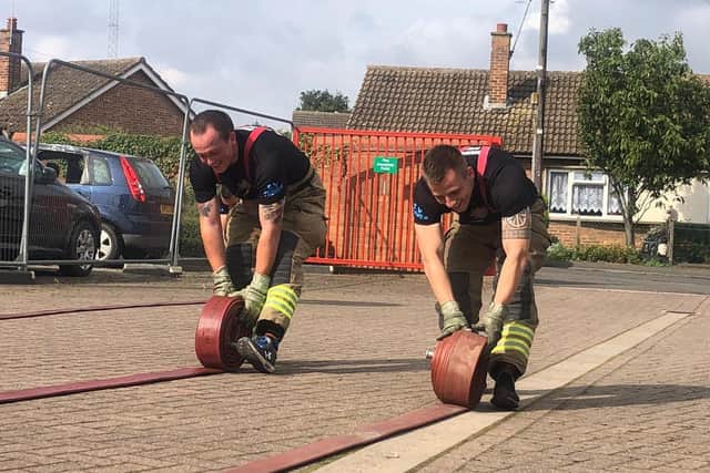 Back-aching work for Billingborough firefighters in their hose challenge. EMN-210913-125916001