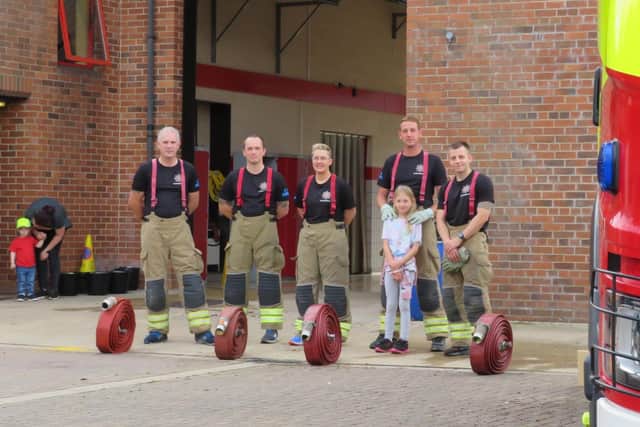 The Billingborough fire crew ahead of their epic fire hose challenge. EMN-210913-125824001