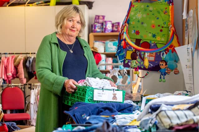 Jill Makinson-Sanders with some of the items at the baby bank.