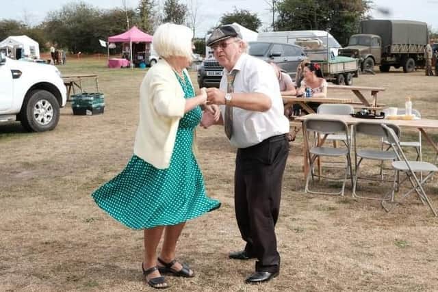 Dancing along to the 1940s beats. EMN-210916-115530001