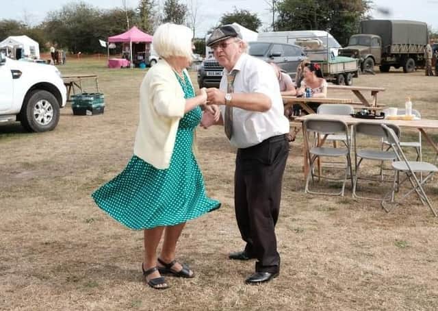 Dancing along to the 1940s beats. EMN-210916-115530001
