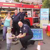 The fire and ambulance station open day was a family affair. From left - Andrew and Alex Failes of Ancaster with son Rowan, 3, meet the Lincolnshire Fire and Resxcue Volunteer Support Service who attend charity events and open days to relieve the front line fire crews as well as helping with tactical and operational training - Mark Smith, Adrian Gledhill and Benjamin Smith. (Also Tom Kirby not pictured). EMN-210920-132535001