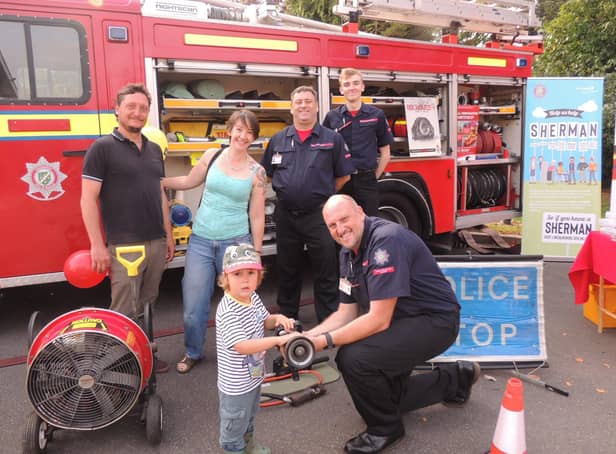 The fire and ambulance station open day was a family affair. From left - Andrew and Alex Failes of Ancaster with son Rowan, 3, meet the Lincolnshire Fire and Resxcue Volunteer Support Service who attend charity events and open days to relieve the front line fire crews as well as helping with tactical and operational training - Mark Smith, Adrian Gledhill and Benjamin Smith. (Also Tom Kirby not pictured). EMN-210920-132535001