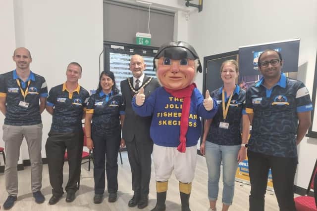 Mayor of Skegness Coun Trevor Burnham and the Jolly Fisherman greet the Flippin Pain team on their arrival at the Tower Gardens Pavilion in Skegness.