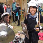 Juliet and Alex Rowles of Dowsby check out the medieval armour at Folkingham Heritage Festival. EMN-210920-133242001