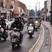 Some of the 70 scooters that rode through Sleaford on Saturday. EMN-210920-132954001