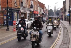 Some of the 70 scooters that rode through Sleaford on Saturday. EMN-210920-132954001