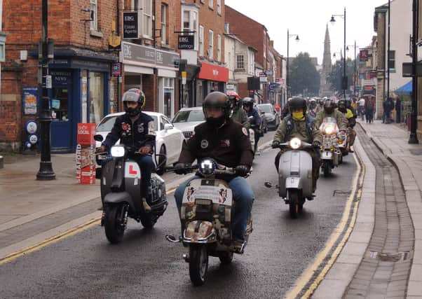 Some of the 70 scooters that rode through Sleaford on Saturday. EMN-210920-132954001