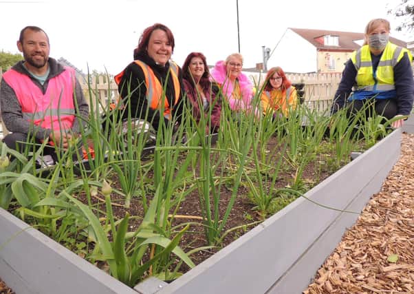Poacher Line volunteers and members of Rainbow Stars at the new allotment on Sleaford station. EMN-210920-173912001