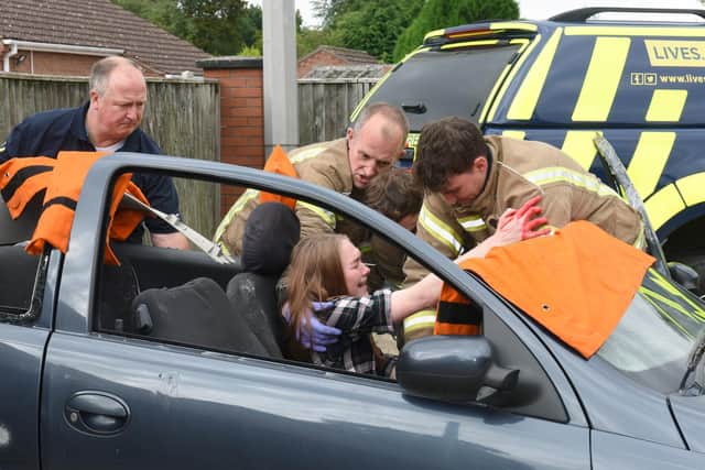 Firefighters rescuing a 'casualty' from the scene of an RTA as part of a trauma training exercise.