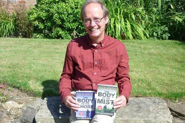 Nick Louth with two of his previous books in the DCI Gillard crime thriller series.
