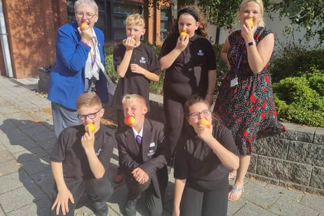 The Class of 26 distributed 1,200 apples to students and staff to celebrate National Eat an Apple Dday.