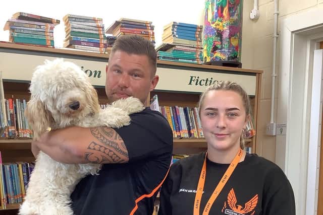 Jack Johnson and his team from Phoenix Fitness met Evie, the Therapy Dog, during their visit to the Richmond School.