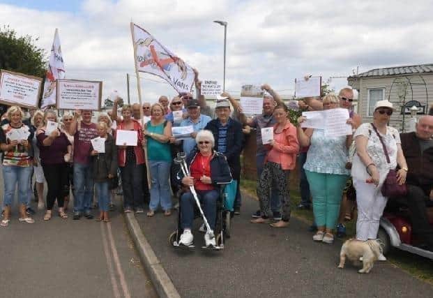 Caravanners have been protesting against a ruling that holiday homes older than 20 years should be removed from East Lindsey District Council's Kingfisher site.