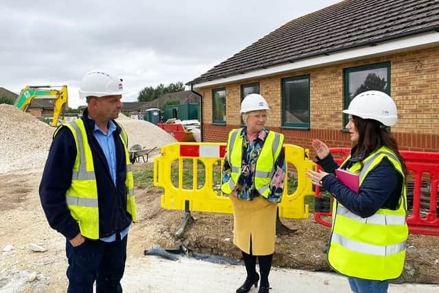 Mandy Irons (Head of Wellbeing at St Barnabas) and Veronica McBain (Head of Fundraising and Lottery at St Barnabas) with Gelder's site manager at Boston Wellbeing Hub. EMN-210921-165319001