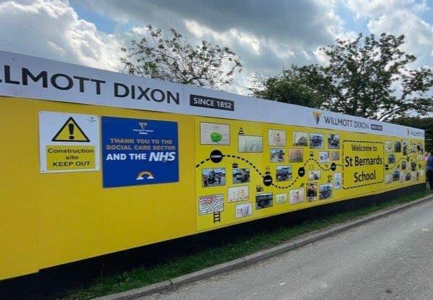 An apparent act of vandalism has damaged part of the hoarding outside St Bernard's School, Louth.