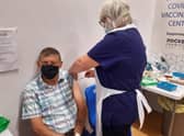 Vaccination nurse Linda Fern delivers the Covid booster jab to 82-year-old Richard Toby of Sleaford. EMN-210922-180254001