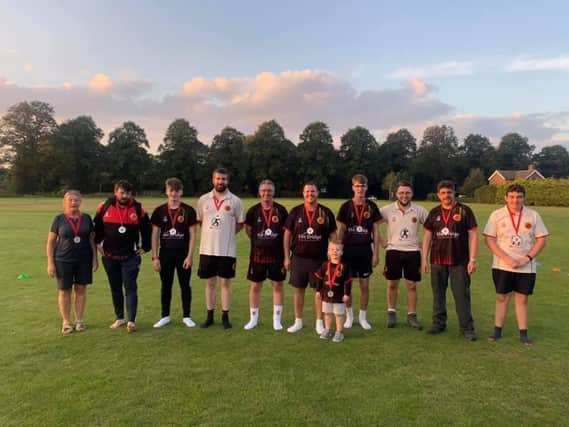 Horncastle Cricket Club members back at the club house after their 26 mile walk.