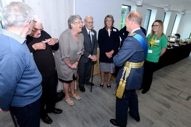 Sharing a joke with some of the backroom staff and fundraisers at the Royal opening event. EMN-210930-093109001
